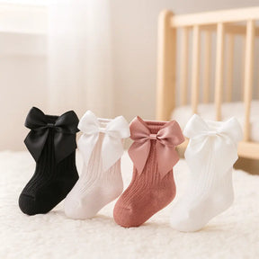 kit-4-pares-de-meias-com-laco-para-bebe-menina-preto-rose-off-white-branco