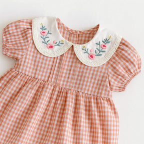 romper xadrez rosa com gola bordada 