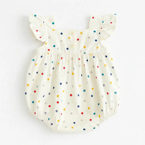 Romper bebê menina verão visto de costas, estampa poá colorida, detalhe de botões e alcinhas com babadinhos.